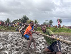 Semangat Kemerdekaan Berkobar di Perbatasan: Prajurit Satgas Pamtas Mobile Yonif 733/Masariku Gelar Lomba Tarik Tambang di Kampung Mumugu