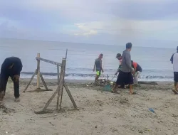 Babinsa Koramil 1404-02/Mattiro Sompe Kerja Bakti Pembersihan Pesisir Pantai